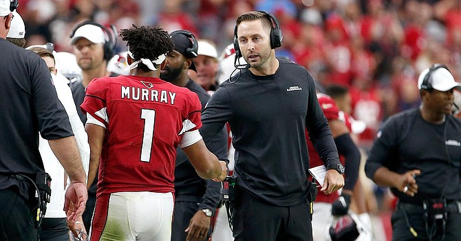 Kliff Kingsbury and Kyler Murray have vastly different relationships with Baker Mayfield. (SI.com)