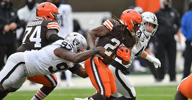Intense wind conditions led to heavy run games by both Browns and Raiders Sunday afternoon. (Jason Miller/Getty Images)