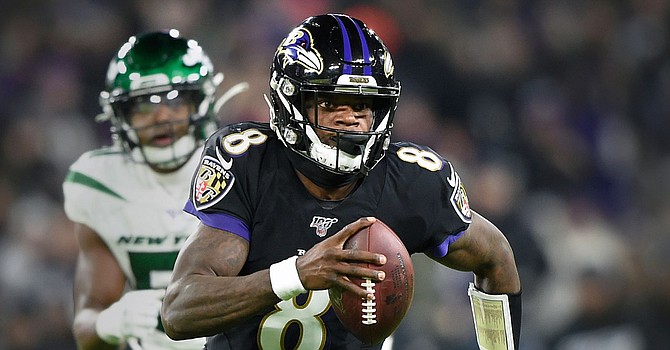 Reigning MVP Lamar Jackson is his team's leading rusher once again. (Dallas Morning News)