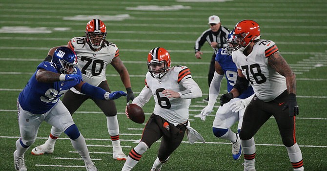 Baker Mayfield coasted with two touchdown passes on 297 yards passing in Browns' 20-6 victory over the Giants, leading to their first double-digit win season since 2007. (Brad Penner/USA Today Sports)