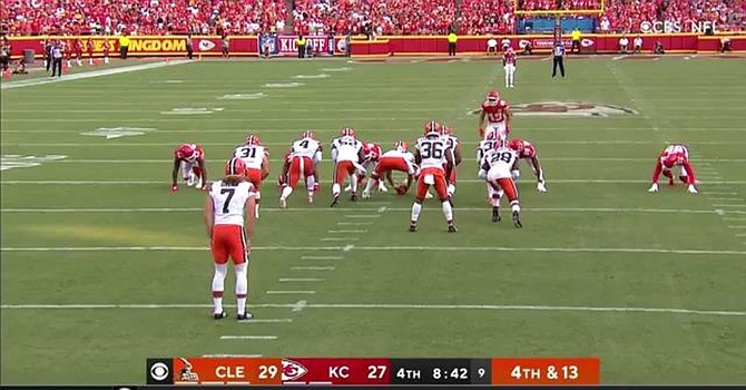 Chiefs coach Andy Reid believes the Arrowhead Stadium crowd caused Jamie Gillan's dropped snap before a punt. (CBS)