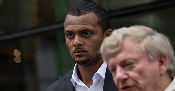 Deshaun Watson -- shown with lawyer Rusty Hardin -- was 'humble, sincere, and candid' in a meeting with the Browns discussing his past and future, they said. (Houston Chronicle)