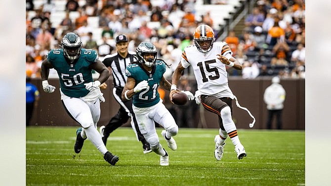 Frank Ryan of the Cleveland Browns drops back to pass during an