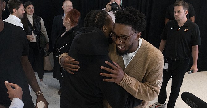 Cavaliers All-Star guards Darius Garland and Donovan Mitchell embrace after Mitchell was introduced as a member of the team. (Rob Lorenzo/ESPN Cleveland)