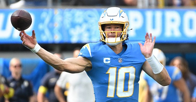 Chargers QB Justin Herbert has piled up some impressive numbers in his first two seasons. It's time for him to take his team to the postseason. (Los Angeles Times)