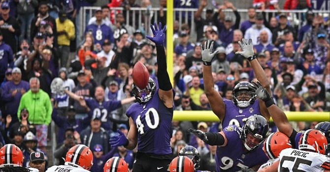 WATCH: John Harbaugh and Marcus Peters have sideline shouting match during  loss - On3