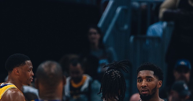 Cavaliers guard Donovan Mitchell and Darius Garland with Los Angeles Lakers forward LeBron James.