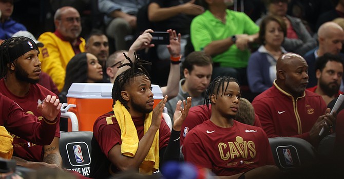 Cavs guards Darius Garland and Isaac Okoro on the bench. ESPN Cleveland/Rob Lorenzo
